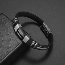 Cargar imagen en el visor de la galería, Classic hand woven multi-layered vegan leather bracelet for men in black with high-quality alloy details on dark textured surface.