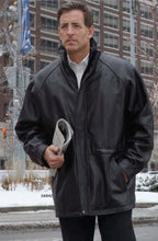 Load image into Gallery viewer, Man wearing REED 34'' Raglan Car Coat in luxurious lamb leather with zip-out lining, showcasing classic style and modern twist.