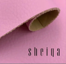 Charger l'image dans la galerie, Close-up of pink textured leather fabric roll with visible fibers on edges.