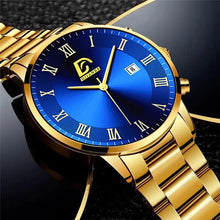 Charger l'image dans la galerie, Gold minimalist men's watch with blue dial and Roman numerals on black background.