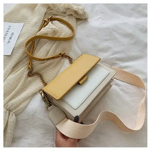Cargar imagen en el visor de la galería, Stylish designer leather crossbody shopping bag with yellow flap and beige strap on a white fabric background