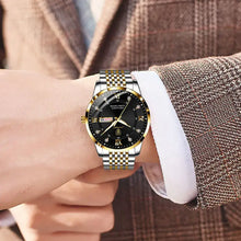 Load image into Gallery viewer, Men's stainless steel watch with a sleek, elegant design and black dial, showcased on wrist of man in suit, perfect for modern style.