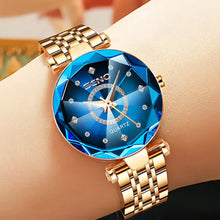 Cargar imagen en el visor de la galería, Elegant blue quartz watch with gold stainless steel band, perfect gift for women, featuring a scratch-resistant dial and water resistance.