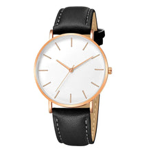 Cargar imagen en el visor de la galería, Simple vegan leather men's luxury watch with minimalist design and gold accents, featuring a classic black strap.