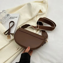 Cargar imagen en el visor de la galería, Brown leather shoulder bag with chain strap on white fabric, showcasing elegant and compact design for any occasion.