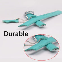 Cargar imagen en el visor de la galería, Close-up of a durable turquoise genuine leather dog collar showcasing material strength and craftsmanship with metal hardware.