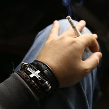 Cargar imagen en el visor de la galería, Rugged men's leather bracelets add sophistication to casual wear, featuring multiple bangles on wrist, outdoors, hand holding cigarette.