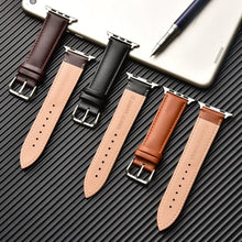 Cargar imagen en el visor de la galería, Elegant brown leather bands for Apple Watch displayed on dark surface, showcasing premium quality and style for Series 1-5 in multiple sizes.