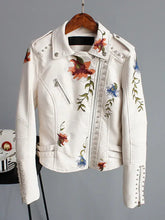 Load image into Gallery viewer, Floral Print Faux Leather Jacket with studded details, featuring vibrant flower embroidery on white faux leather.