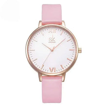 Load image into Gallery viewer, Luxury pink leather-strap watch with gold case, featuring a minimalist white dial and Roman numerals, exemplifying elegance and style.