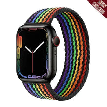 Load image into Gallery viewer, Rainbow-colored nylon strap for Apple Watch, compatible with various models, shown on a sleek black watch face.