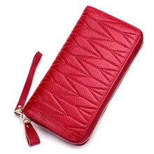 Cargar imagen en el visor de la galería, Red leather female travel purse with textured design and wrist strap, perfect for organizing travel essentials in style.