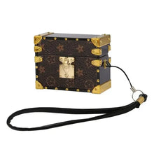 Cargar imagen en el visor de la galería, Brown leather AirPods Pro case with gold accents and strap, designed to protect and add elegance to your device.