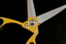 Cargar imagen en el visor de la galería, Close-up of heavy duty eZthings scissors with gold handles for cutting fabrics and crafts.