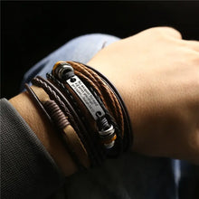 Cargar imagen en el visor de la galería, Men's leather bracelets and bangles showcasing rugged sophistication and style on a wrist, perfect for casual or formal wear.