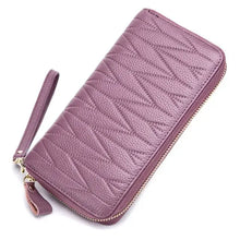 Cargar imagen en el visor de la galería, Purple leather female travel purse with wrist strap, perfect for organizing essentials stylishly on the go.