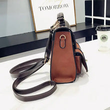 Load image into Gallery viewer, Vintage paneled PU leather women's backpack with adjustable straps, showcased on a table, perfect for stylish, vegan-friendly fashion.