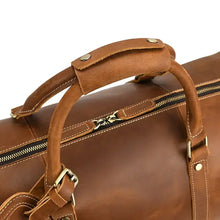 Cargar imagen en el visor de la galería, Close-up of The Dagny Weekender | Large Leather Duffle Bag showcasing durable full-grain leather handle and zipper detail.