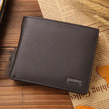Cargar imagen en el visor de la galería, Men's Premium Leather Wallet on a wooden surface, showcasing elegant design and genuine leather texture for stylish everyday carry.