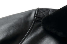 Load image into Gallery viewer, Close-up of REED Men's Premium Leather Aviator Bomber Jacket showing soft, durable imported leather and black fur collar.