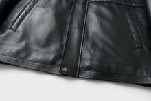 Load image into Gallery viewer, Close-up of REED 34'' Raglan Car Coat in black lamb leather with zip-out lining, featuring sleek design and soft durable touch.