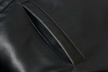 Load image into Gallery viewer, Close-up of pocket detail on REED 34'' Raglan Car Coat in Imported Lamb leather with sleek lining.