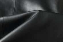 Load image into Gallery viewer, Close-up of black lamb leather fabric for REED men's car coat with soft, durable texture.