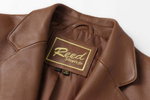 Cargar imagen en el visor de la galería, REED Men's Premium Lambskin Leather Blazer close-up showing logo and luxurious texture