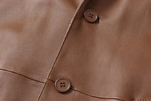 Cargar imagen en el visor de la galería, Close-up of buttons on REED Men's Premium Lambskin Leather Blazer in soft brown leather.