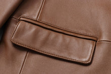 Cargar imagen en el visor de la galería, Close-up of REED Men's Premium Lambskin Leather Blazer in brown, showcasing soft-touch leather and meticulous stitching. Ideal for timeless style.