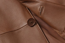 Cargar imagen en el visor de la galería, Close-up of REED Men's Premium Lambskin Leather Blazer button and texture, showcasing the luxurious soft-touch quality of the garment.