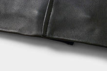 Load image into Gallery viewer, Close-up of genuine lambskin leather from REED EST. 1950 Men's Jacket, showcasing the premium craftsmanship and soft texture.
