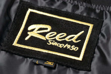 Load image into Gallery viewer, Close-up of Reed brand label on men's baseball suede leather jacket with satin lining.