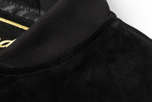 Load image into Gallery viewer, Close-up of a black suede leather collar on a REED men's baseball jacket with satin lining, showcasing high-quality craftsmanship.