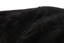 Load image into Gallery viewer, Close-up of black suede leather texture from REED Men's Baseball Jacket, highlighting soft supple touch and stitching detail.