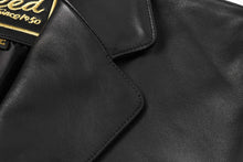 Cargar imagen en el visor de la galería, Close-up of REED Men's Premium Lambskin Leather Blazer with soft-touch finish and American fit. Stylish, durable, and classic design.
