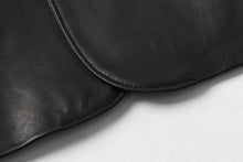 Cargar imagen en el visor de la galería, Close-up of REED Men's Premium Lambskin Leather Blazer showcasing smooth texture and superior craftsmanship.