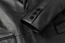Cargar imagen en el visor de la galería, Close-up of REED Men's Premium Lambskin Leather Blazer, showcasing sleek button detailing and soft durable leather texture.