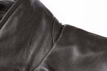 Cargar imagen en el visor de la galería, Close-up of REED Men's New Zealand lambskin leather jacket showing soft, smooth black leather texture.