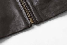 Cargar imagen en el visor de la galería, Close-up of black lambskin leather jacket with zipper detail, showcasing soft texture. Ideal for style and comfort by REED.