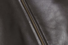 Cargar imagen en el visor de la galería, Close-up of a black lambskin leather jacket zipper, showcasing the fine texture and craftsmanship of New Zealand origin.