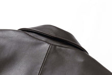 Cargar imagen en el visor de la galería, Close-up of black lambskin leather jacket collar by REED, highlighting smooth texture and quality craftsmanship.