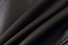 Load image into Gallery viewer, Close-up of genuine lambskin leather texture in dark brown, highlighting the soft and premium quality material used in REED's men's jackets.