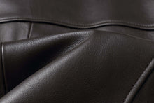Load image into Gallery viewer, Close-up of genuine lambskin leather texture from REED EST. 1950 Men's Jacket, showing premium quality and softness.