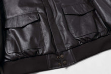 Load image into Gallery viewer, Close-up of REED Men's Premium Leather Aviator Bomber Jacket with front pockets and durable imported leather.