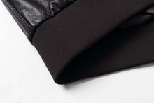 Load image into Gallery viewer, Close-up of REED Men's Premium Leather Aviator Bomber Jacket showing knit cuffs and leather texture.