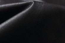 Load image into Gallery viewer, Close-up of the luxurious leather texture of the REED Men's Premium Leather Aviator Bomber Jacket, showcasing its quality craftsmanship.
