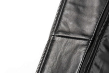Cargar imagen en el visor de la galería, Close-up of black lambskin leather jacket with zipper detail by REED, showcasing smooth texture and premium New Zealand leather.