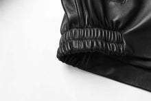 Cargar imagen en el visor de la galería, Detail of REED Men's New Zealand Lambskin Leather Jacket, showing black elastic cuff for style and comfort.