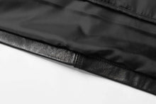Load image into Gallery viewer, Close-up of REED men's lambskin leather jacket, black with soft interior fabric and genuine leather texture.